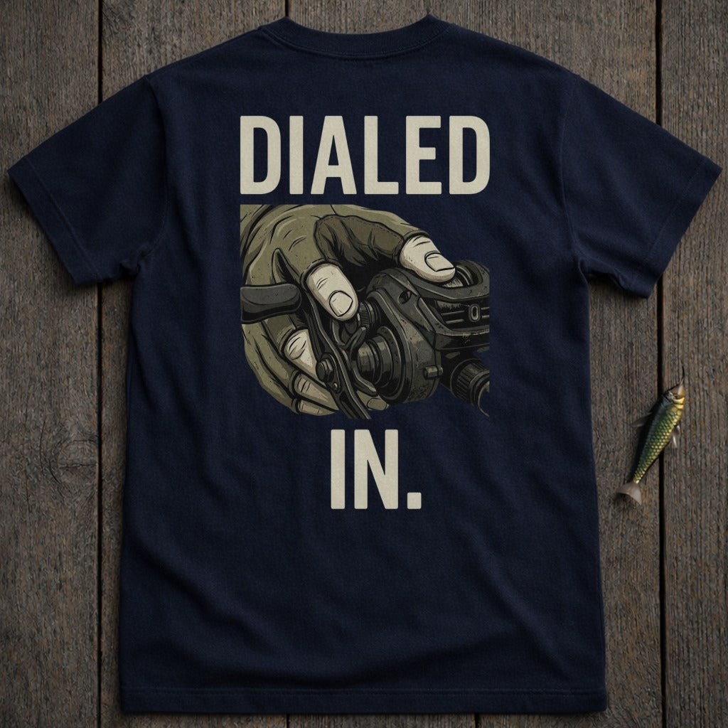 Navy t-shirt with "DIALED IN." and hand holding fishing reel.