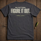 Dark t-shirt with "NO PATTERN. FIGURE IT OUT." text and a small graphic.