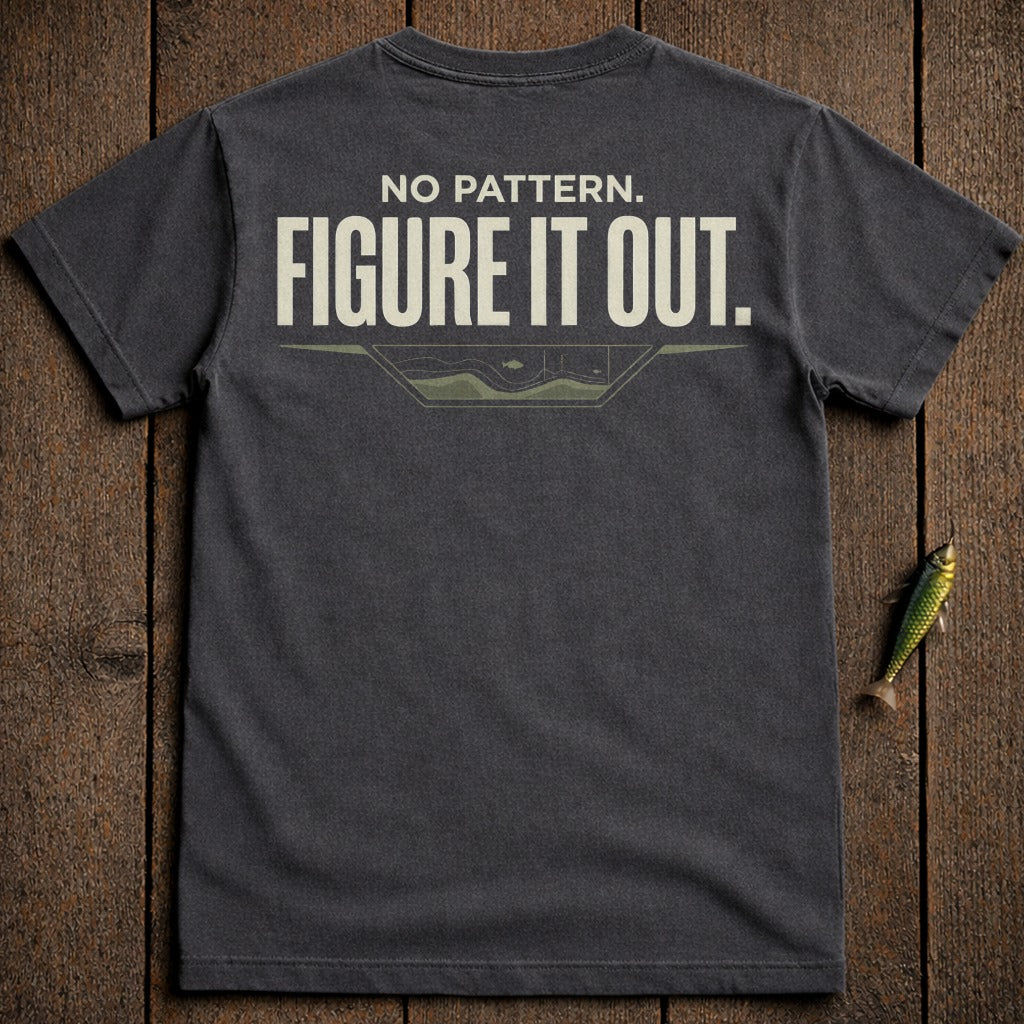 Dark t-shirt with "NO PATTERN. FIGURE IT OUT." text and a small graphic.