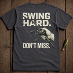 T-shirt with "Swing Hard. Don't Miss." and a fishing reel graphic.