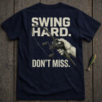 Navy t-shirt with "Swing Hard. Don't Miss." and fishing reel graphic.