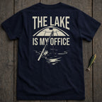Dark blue t-shirt with text "The Lake Is My Office" and a fishing rod.