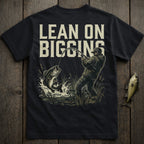 Dark t-shirt with graphic of a fisherman reeling in a jumping bass.