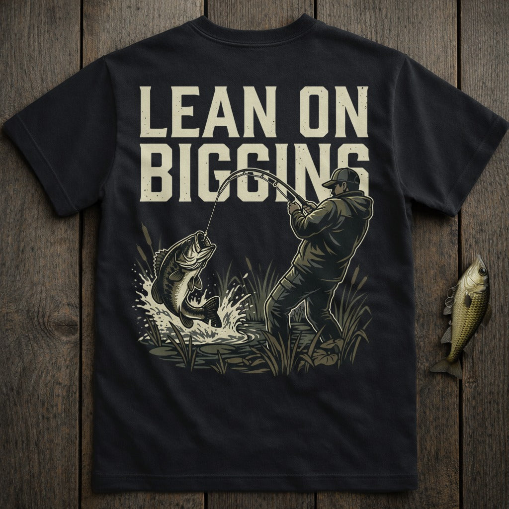 Dark t-shirt with graphic of a fisherman reeling in a jumping bass.