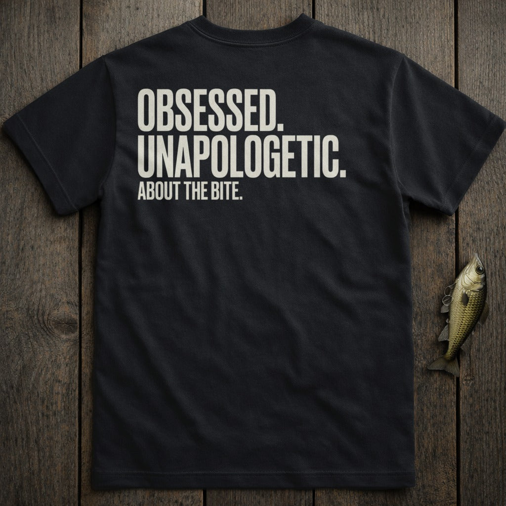 Black t-shirt with white text "OBSESSED. UNAPOLOGETIC. ABOUT THE BITE."