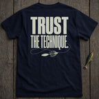 Navy t-shirt with "TRUST THE TECHNIQUE." and fishing lure graphic.