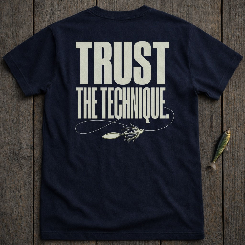 Navy t-shirt with "TRUST THE TECHNIQUE." and fishing lure graphic.