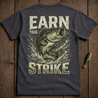 Dark t-shirt with largemouth bass leaping and text "EARN YOUR STRIKE".