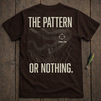 Brown t-shirt with "THE PATTERN OR NOTHING." text and topographic map design.
