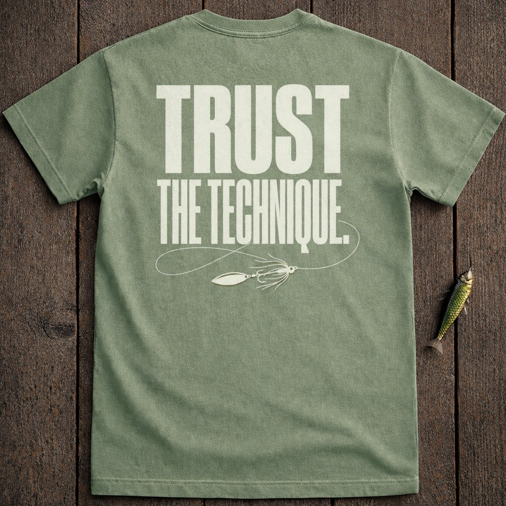 Olive green t-shirt with "TRUST THE TECHNIQUE" and fishing lure graphic.