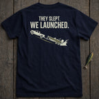 Navy t-shirt with truck launching boat graphic and text "THEY SLEPT. WE LAUNCHED."