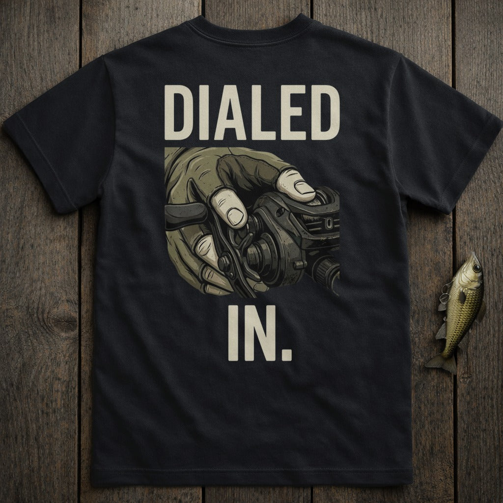 Black t-shirt with "DIALED IN." text and a hand holding a fishing reel.
