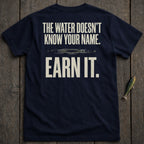 Navy t-shirt with "The water doesn't know your name. Earn it." text.
