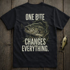 Dark t-shirt with a bass fish and fishing lure, text "ONE BITE CHANGES EVERYTHING".