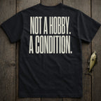 Dark t-shirt with white text "NOT A HOBBY. A CONDITION."