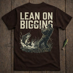 Fisherman reeling in a large bass, with "LEAN ON BIGGINS" text above.