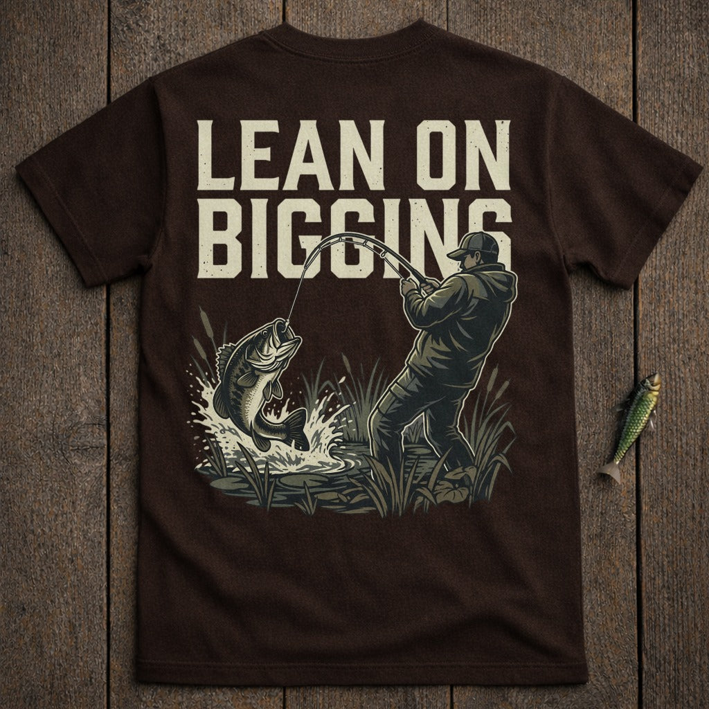 Fisherman reeling in a large bass, with "LEAN ON BIGGINS" text above.