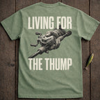 Green t-shirt with "LIVING FOR THE THUMP" and a fishing rod.