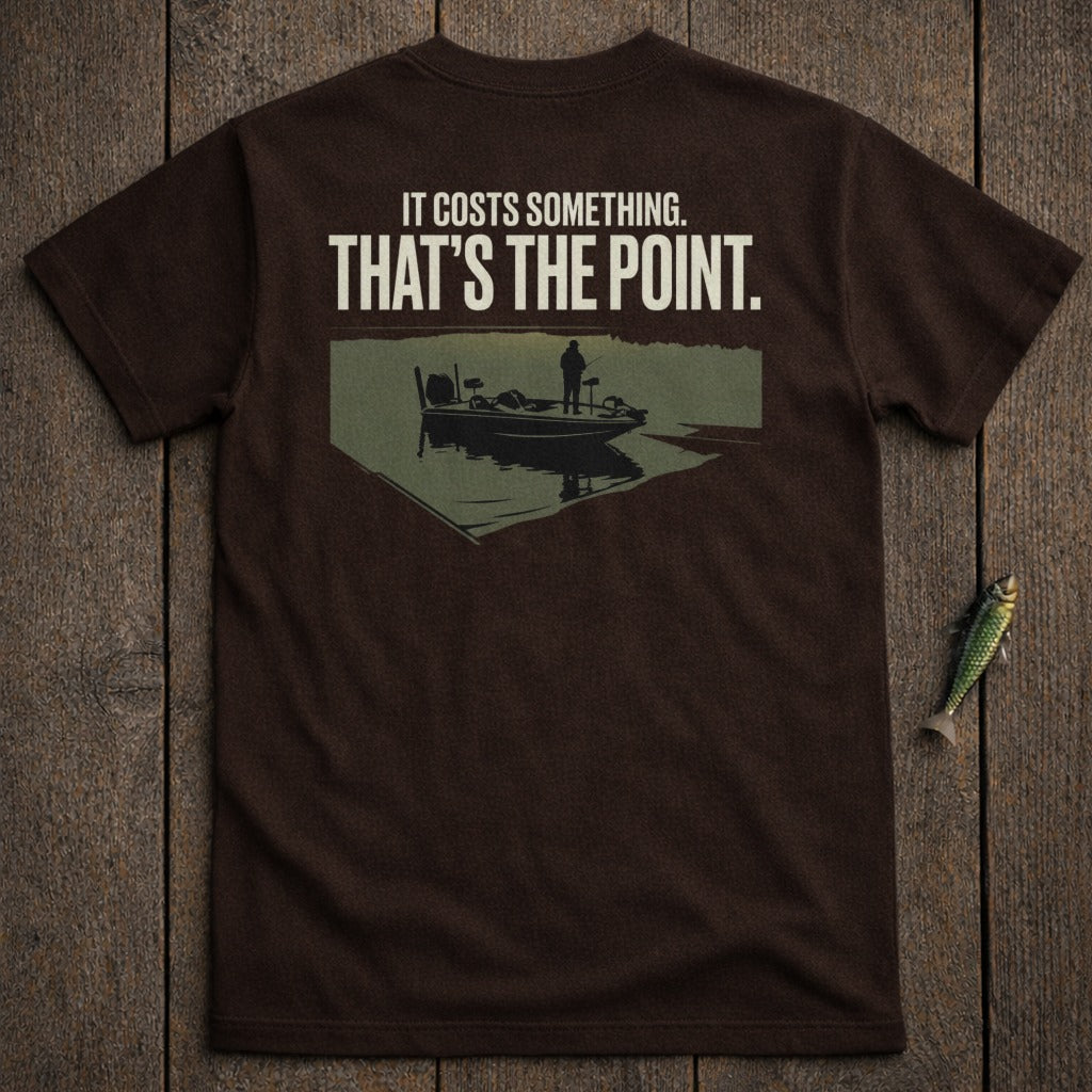 Brown t-shirt with text and graphic of a person fishing from a boat.