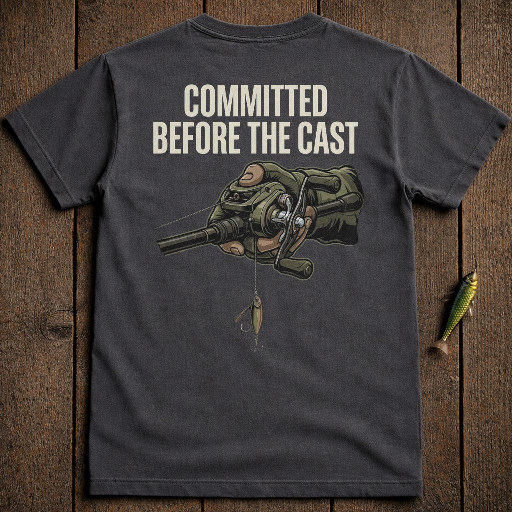 T-shirt with "Committed Before the Cast" text and fishing reel illustration.