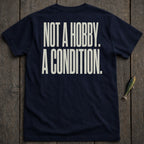 Navy t-shirt with white text "NOT A HOBBY. A CONDITION."