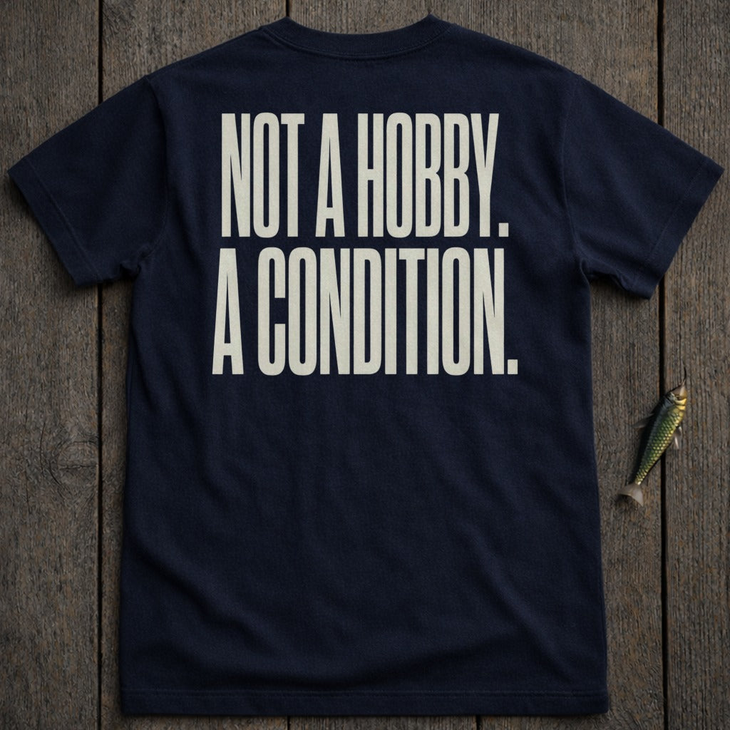 Navy t-shirt with white text "NOT A HOBBY. A CONDITION."