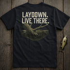 Black t-shirt with "LAYDOWN. LIVE THERE." text and a submerged tree branch graphic.