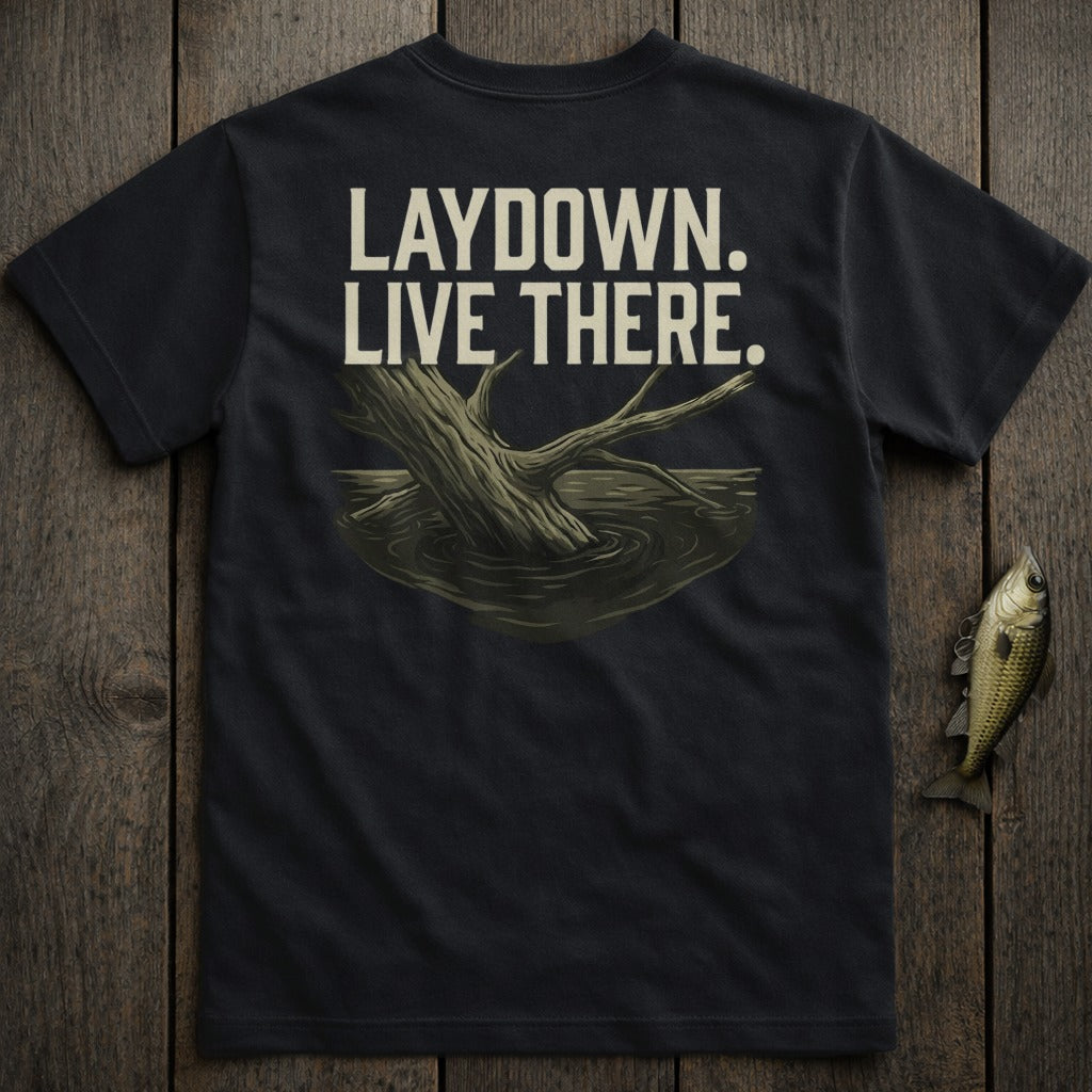 Black t-shirt with "LAYDOWN. LIVE THERE." text and a submerged tree branch graphic.
