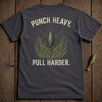 Dark t-shirt with "PUNCH HEAVY. PULL HARDER." text and fishing lure graphic.