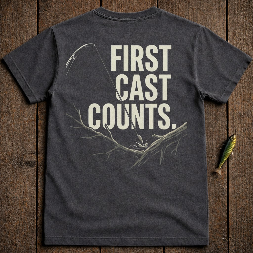 Dark t-shirt with "FIRST CAST COUNTS." text and fishing scene.