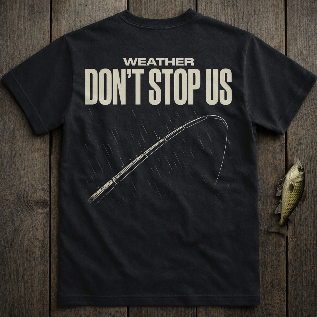 Dark t-shirt with "WEATHER DON'T STOP US" and fishing rod in rain.