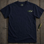 Navy t-shirt with a green and white fish logo on the left chest.