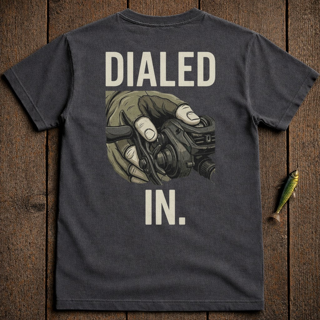 Dark t-shirt with "DIALED IN." text and a hand holding a fishing reel.