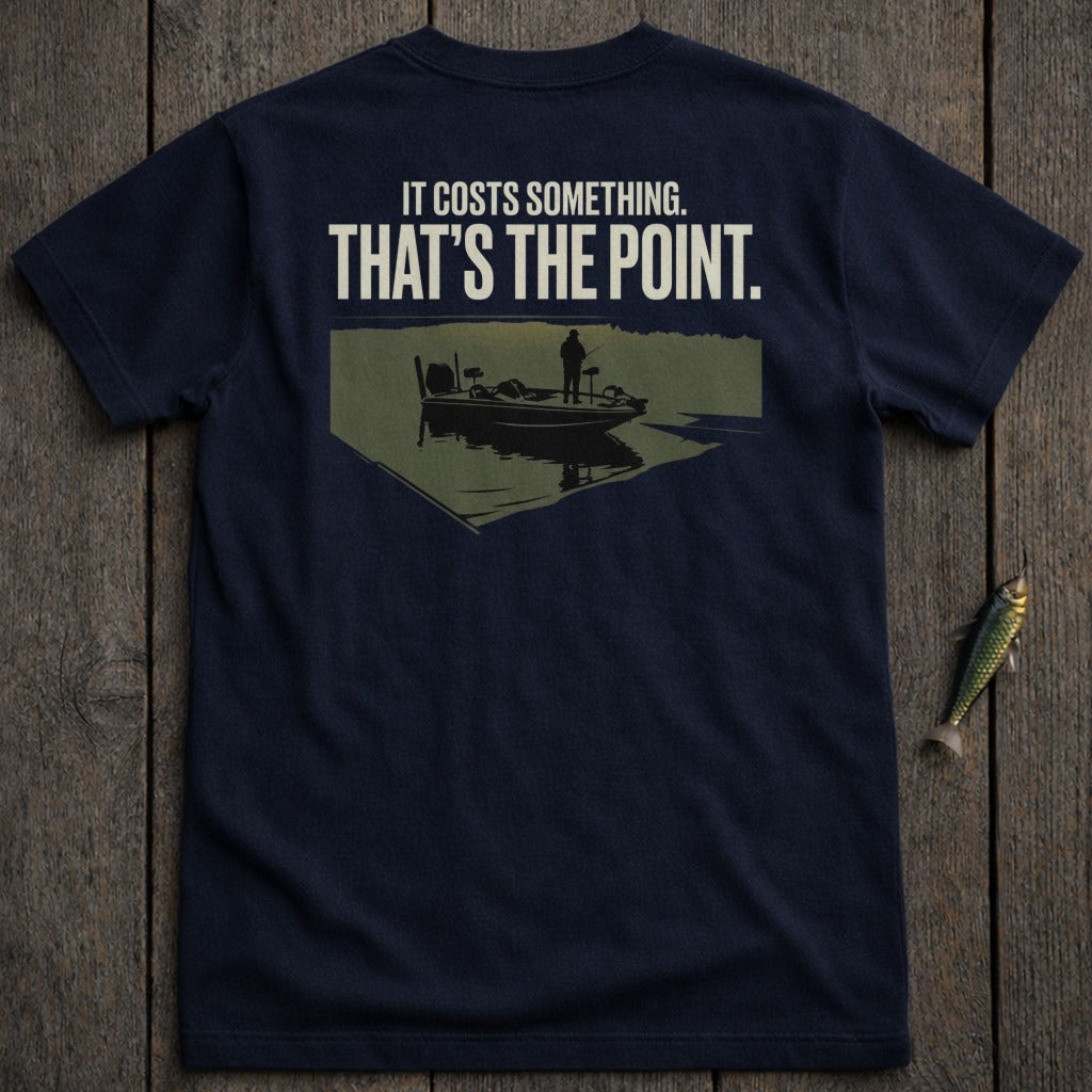 Navy t-shirt with graphic of a fisherman on a boat with text "IT COSTS SOMETHING. THAT'S THE POINT."