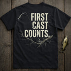 Black t-shirt with "FIRST CAST COUNTS." text and fishing graphic.