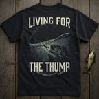 Black t-shirt with graphic of a large bass leaping from water, text "LIVING FOR THE THUMP".