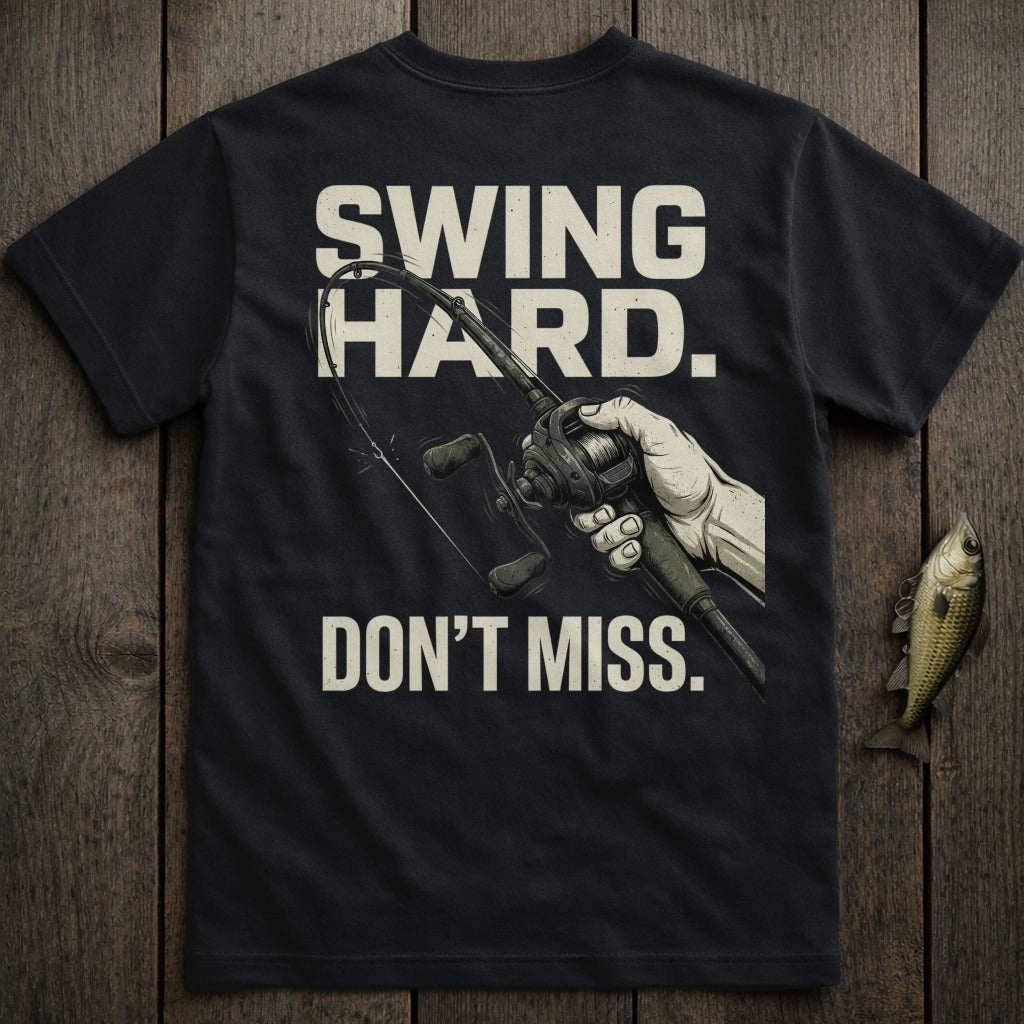 Black t-shirt with "SWING HARD. DON'T MISS." and a fishing rod illustration.
