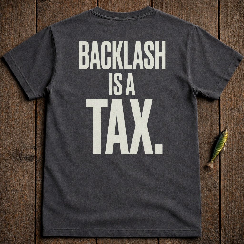 Dark t-shirt with white text "BACKLASH IS A TAX."