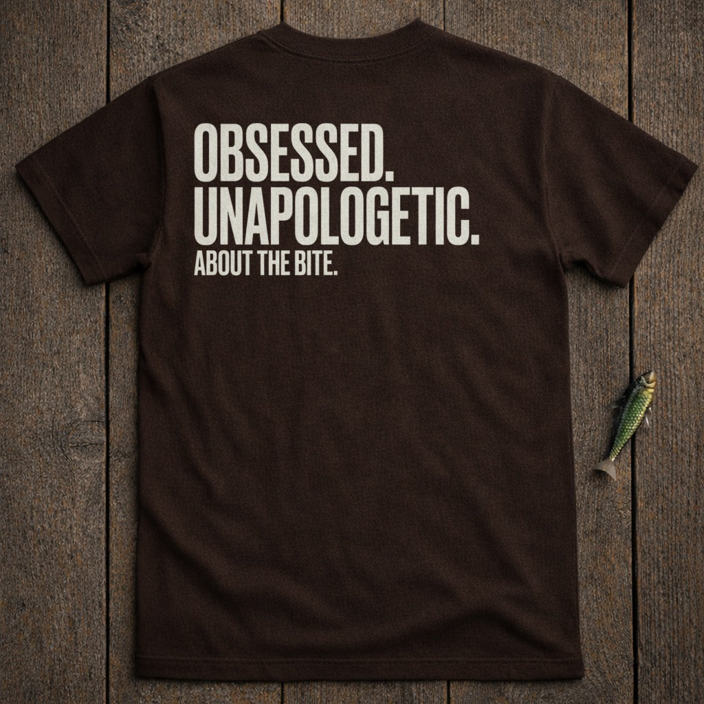 Brown t-shirt with white text "OBSESSED. UNAPOLOGETIC. ABOUT THE BITE."