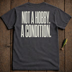 Dark gray t-shirt with "NOT A HOBBY. A CONDITION." text in cream.