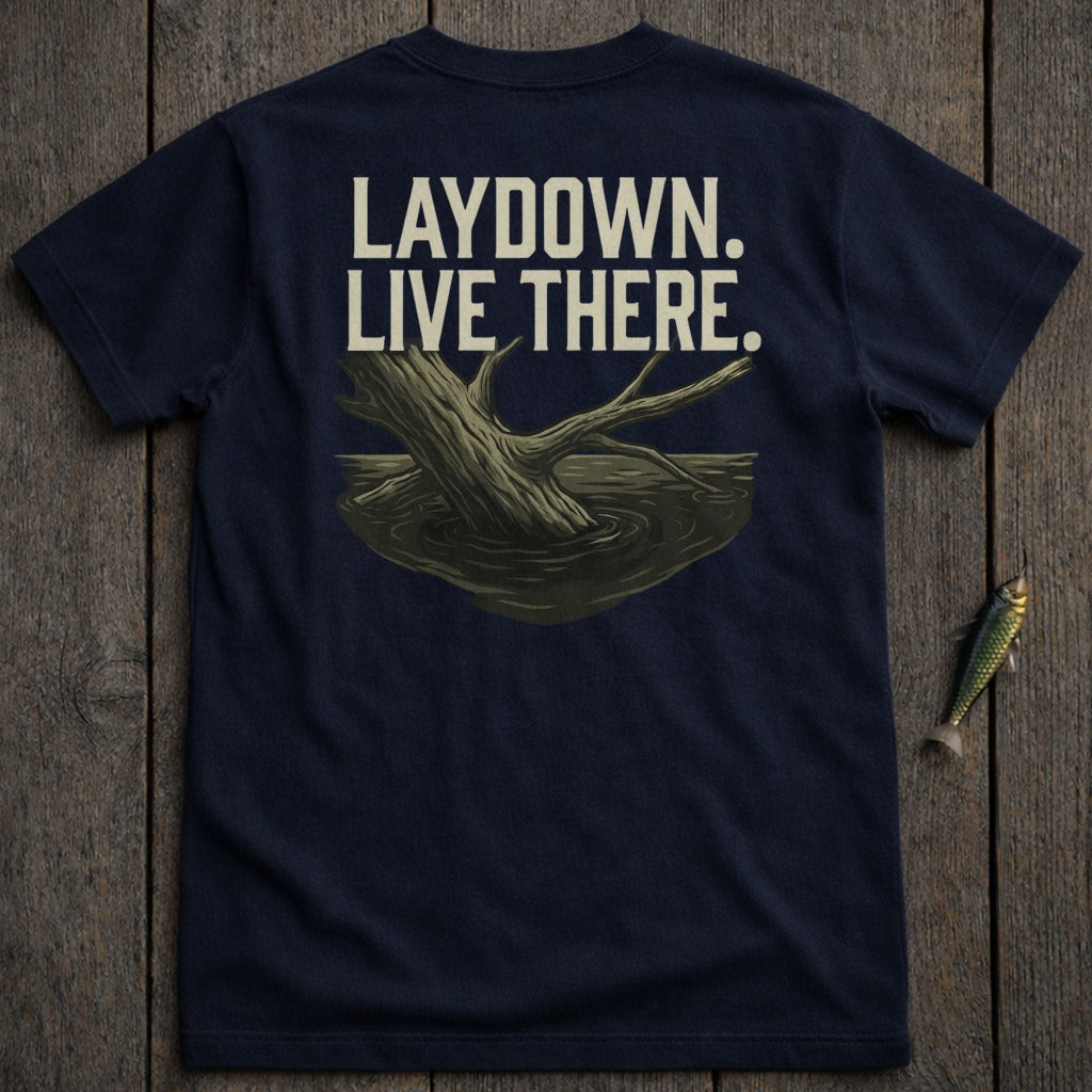 Navy t-shirt with "LAYDOWN. LIVE THERE." text and tree trunk in water graphic.
