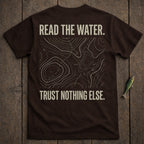 Brown t-shirt with "READ THE WATER. TRUST NOTHING ELSE." and topographical map design.