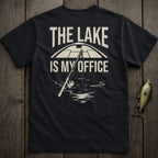 Black t-shirt with "THE LAKE IS MY OFFICE" text and fishing rod graphic.