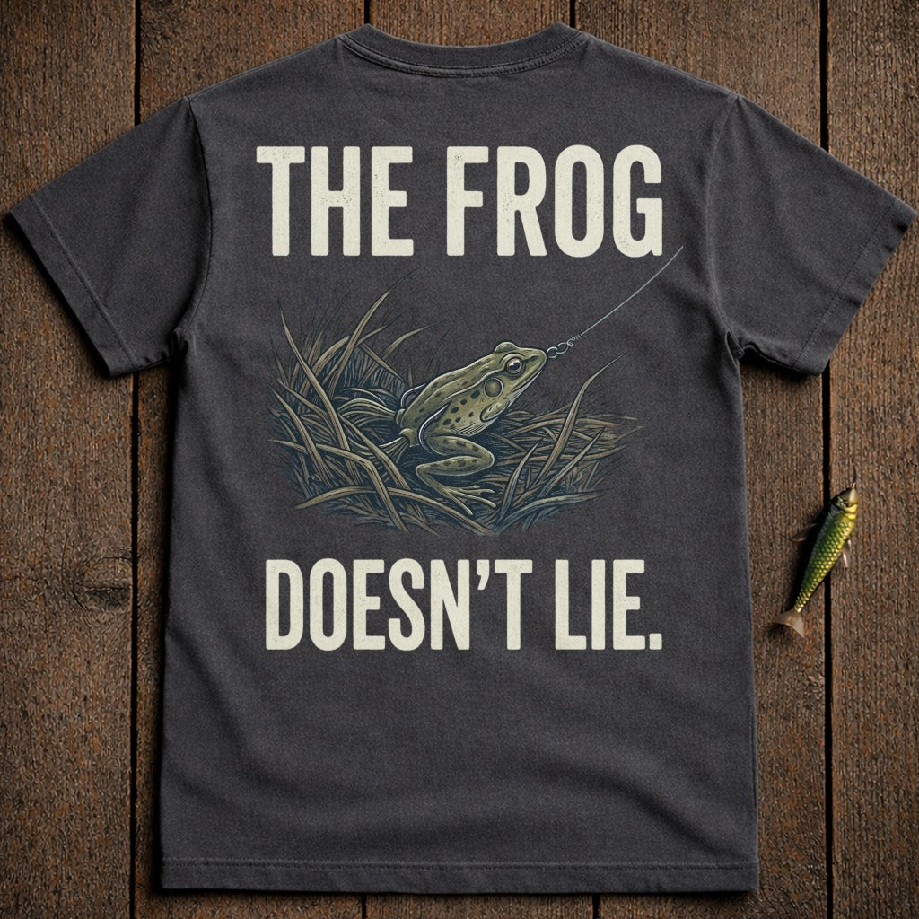 T-shirt graphic of a frog on a fishing lure with text "THE FROG DOESN'T LIE".