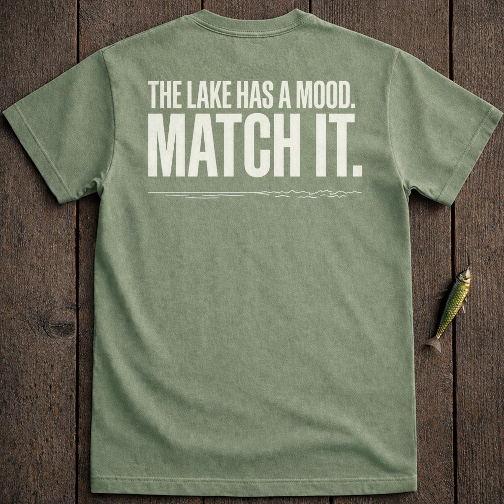 Green t-shirt with white text "The lake has a mood. Match it."