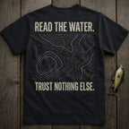 Black t-shirt with topographic map design and text "READ THE WATER. TRUST NOTHING ELSE."