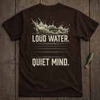 Brown t-shirt with splashing water and fish graphic, text "Loud Water. Quiet Mind."