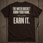 Brown t-shirt with "The water doesn't know your name. Earn it." text.
