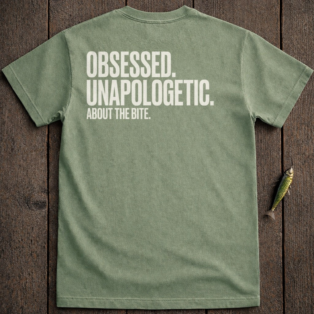 Olive green t-shirt with white text "Obsessed. Unapologetic. About the Bite."