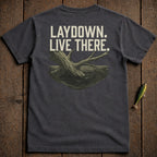Dark t-shirt with "LAYDOWN. LIVE THERE." text and submerged log graphic.